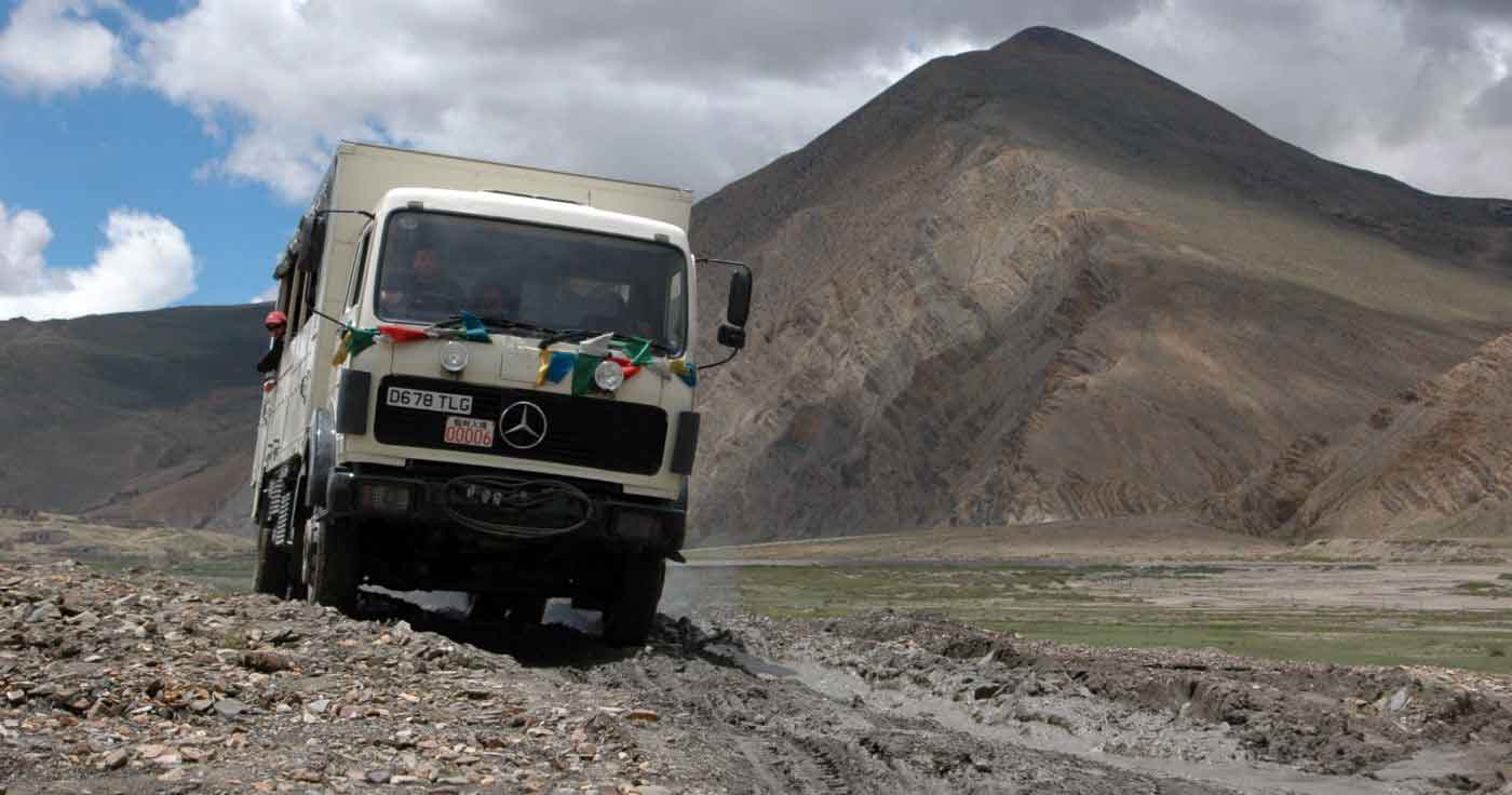 Driving a truck along a dirt road in China